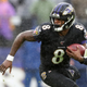 Quarterback Lamar Jackson #8 of the Baltimore Ravens runs with the ball against the San Francisco 49ers in the first half at M&T Bank Stadium on Dec. 1, 2019, in Baltimore.